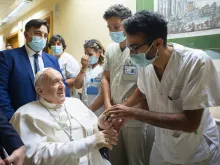 Pope Francis greets staff at the Gemelli Hospital in Rome, July 11, 2021.